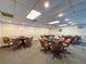 Well-lit card room featuring multiple poker tables surrounded by comfortable chairs, perfect for game nights at 10635 Timber Ln, Port Richey, FL 34668
