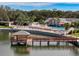 Scenic view of the community lake, with a pier and pool creating an ideal outdoor space at 10635 Timber Ln, Port Richey, FL 34668