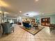 Bright lobby with tile floors, cozy seating areas, and an inviting reception desk at 10635 Timber Ln, Port Richey, FL 34668