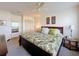 Relaxing main bedroom with a king-sized bed, ceiling fan, and closet space at 10635 Timber Ln, Port Richey, FL 34668