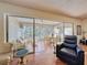 Bright sunroom with large sliding glass doors offering views of the outdoors at 10635 Timber Ln, Port Richey, FL 34668