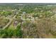 Sprawling aerial view showcases the home's location in a serene, wooded neighborhood at 11326 Minnieola Dr, New Port Richey, FL 34654