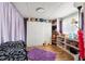 Organized bedroom featuring ample storage, shelving, and comfortable furnishings at 11326 Minnieola Dr, New Port Richey, FL 34654