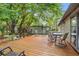 A spacious wooden deck is furnished with patio furniture and overlooks the yard at 11326 Minnieola Dr, New Port Richey, FL 34654