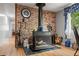 Close-up view of a rustic brick fireplace with wood storage at 11326 Minnieola Dr, New Port Richey, FL 34654