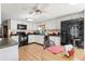 View of the kitchen with white cabinets and black appliances at 11326 Minnieola Dr, New Port Richey, FL 34654