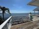 Waterfront balcony with white railings overlooking calm blue waters at 121 Augusta Ave, Palm Harbor, FL 34683