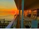 Scenic sunset reflecting on the water as seen from the waterfront balcony at 121 Augusta Ave, Palm Harbor, FL 34683