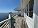 Balcony with decorative railing, perfect for outdoor relaxation and enjoyment of stunning water views on this sunny day at 121 Augusta Ave, Palm Harbor, FL 34683