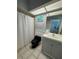 Bathroom with a shower/tub combo, toilet, and sink vanity at 121 Augusta Ave, Palm Harbor, FL 34683