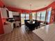 Bright dining room featuring water views, a table with seating for six and access to the outdoor deck at 121 Augusta Ave, Palm Harbor, FL 34683