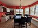 Bright dining room with water views, a table with seating for six, and access to the outdoor deck at 121 Augusta Ave, Palm Harbor, FL 34683