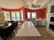Bright kitchen featuring white countertops, tile floors, and views of the water at 121 Augusta Ave, Palm Harbor, FL 34683