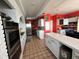 Kitchen features stainless steel appliances, a center island, and plenty of cabinet space at 121 Augusta Ave, Palm Harbor, FL 34683