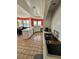 Kitchen featuring an island, tile flooring, stainless steel appliances and a view into the dining room at 121 Augusta Ave, Palm Harbor, FL 34683