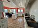 Bright kitchen featuring white countertops, tile floors, and views of the water at 121 Augusta Ave, Palm Harbor, FL 34683