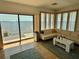 Living room with a view of the ocean, hardwood floors, and lots of natural light at 121 Augusta Ave, Palm Harbor, FL 34683