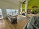 Spacious living room with a fireplace, water views, and comfortable seating at 121 Augusta Ave, Palm Harbor, FL 34683