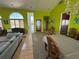 Spacious living room with a large dining area and unique decor at 121 Augusta Ave, Palm Harbor, FL 34683