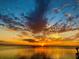 Beautiful sunset view over the water, highlighting the serene and picturesque surroundings of the property at 121 Augusta Ave, Palm Harbor, FL 34683
