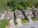 Aerial view of homes with fenced yards, pools and tree lined neighborhood streets at 1250 Halapa Way, Trinity, FL 34655