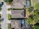 Birds eye view of neighborhood homes with screened in pools and well-maintained yards at 1250 Halapa Way, Trinity, FL 34655
