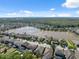 Beautiful neighborhood with homes built around a scenic lake on a clear day at 1250 Halapa Way, Trinity, FL 34655