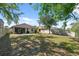 Large backyard with patio, playground, and fenced yard at 1250 Halapa Way, Trinity, FL 34655