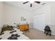 Bedroom with ceiling fan, closet, and wood dresser at 1250 Halapa Way, Trinity, FL 34655