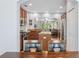 Kitchen view through dining area, showcasing stainless steel appliances and open floor plan at 1250 Halapa Way, Trinity, FL 34655