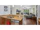 Open-concept kitchen featuring a view to the living room and stainless steel appliances at 1250 Halapa Way, Trinity, FL 34655