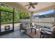 Screened lanai with comfortable seating offering views of the fenced backyard at 1250 Halapa Way, Trinity, FL 34655
