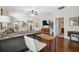 Cozy living room featuring hardwood floors, a ceiling fan, and an open layout at 1250 Halapa Way, Trinity, FL 34655