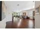 Spacious living room boasting hardwood floors and ample natural light from the sliding glass doors at 1250 Halapa Way, Trinity, FL 34655