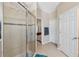 Glass shower featuring tile and adjacent doors at 1250 Halapa Way, Trinity, FL 34655