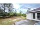 Backyard featuring a patio area, mature trees, and natural landscape at 13066 Painted Bunting Ave, Weeki Wachee, FL 34614