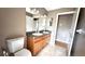 Bathroom featuring a double sink vanity with tile flooring and ample lighting at 13066 Painted Bunting Ave, Weeki Wachee, FL 34614
