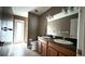 Bathroom featuring a double sink vanity, tile floor, and neutral wall color at 13066 Painted Bunting Ave, Weeki Wachee, FL 34614
