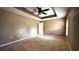 Neutral bedroom featuring a ceiling fan and carpeted floor at 13066 Painted Bunting Ave, Weeki Wachee, FL 34614