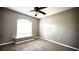 Bedroom with a large window providing natural light, creating a bright and airy space at 13066 Painted Bunting Ave, Weeki Wachee, FL 34614