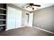Bedroom featuring built-in shelves and double-door closet, offering ample storage space at 13066 Painted Bunting Ave, Weeki Wachee, FL 34614