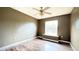 Bedroom featuring a ceiling fan, wood floors, and a window at 13066 Painted Bunting Ave, Weeki Wachee, FL 34614