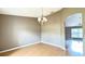 Dining room with wood floors and a chandelier at 13066 Painted Bunting Ave, Weeki Wachee, FL 34614