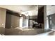 Eat-in kitchen featuring modern appliances, a breakfast bar, and open layout to the living area at 13066 Painted Bunting Ave, Weeki Wachee, FL 34614