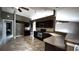 Well-equipped kitchen with tile flooring, granite countertops, and modern black appliances at 13066 Painted Bunting Ave, Weeki Wachee, FL 34614