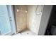 Enclosed shower with glass door and tile surround, providing a clean and modern look at 13066 Painted Bunting Ave, Weeki Wachee, FL 34614