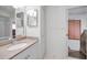 Close-up of bathroom sink and mirror with attached bathroom at 1615 Cortleigh Dr, New Port Richey, FL 34655