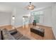 Spacious living room featuring high ceilings, wood floors, and lots of natural light at 1615 Cortleigh Dr, New Port Richey, FL 34655