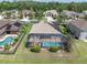 Aerial view of a screened pool in a manicured backyard at 1709 Nodding Thistle Dr, New Port Richey, FL 34655