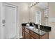 Bathroom with updated fixtures, granite countertop, and modern vanity at 1709 Nodding Thistle Dr, New Port Richey, FL 34655